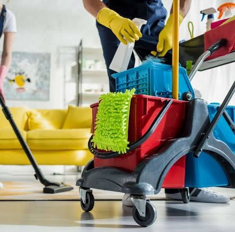 Detail of a cleaning cart with mop, bucket, and supplies ready for use